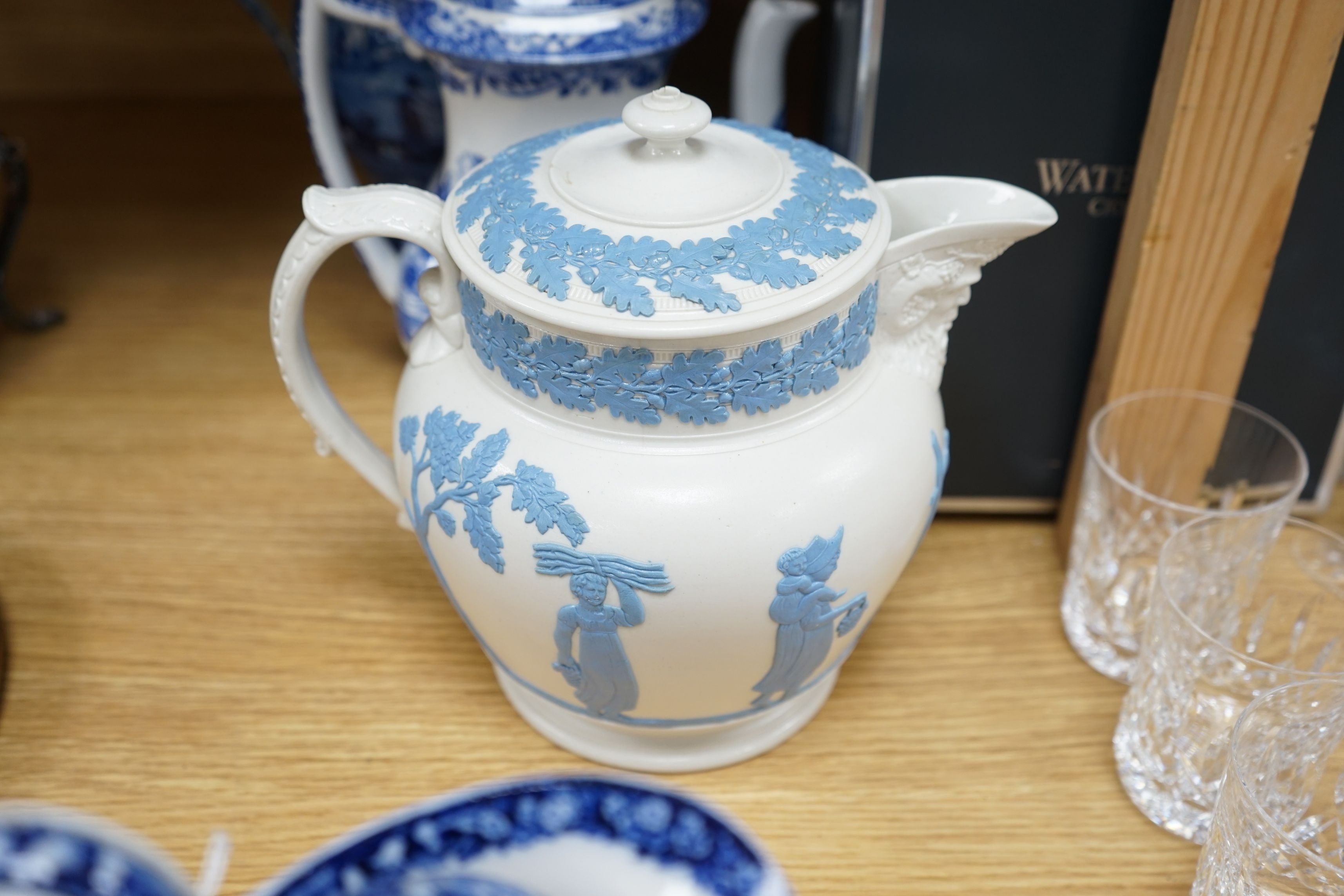 An early 19th century pearlware blue and white tea pot, two others and a Wedgwood style teapot, tallest 30cms high
